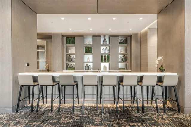 a kitchen with a table and chairs