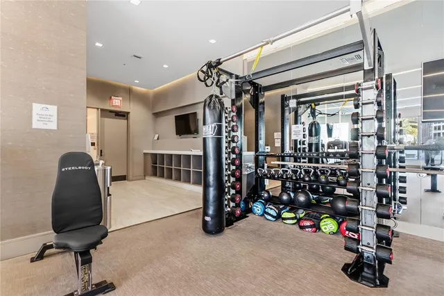 a bedroom with furniture and a ceiling fan