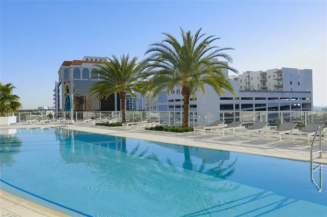 a view of swimming pool with outdoor seating
