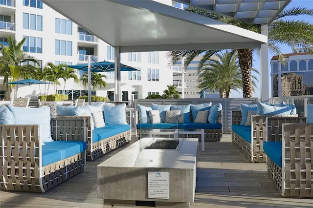 a view of a chairs and table in the patio