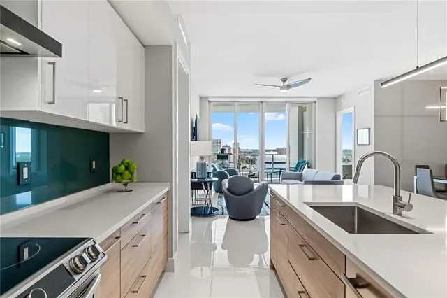 a kitchen with a sink stove and cabinets
