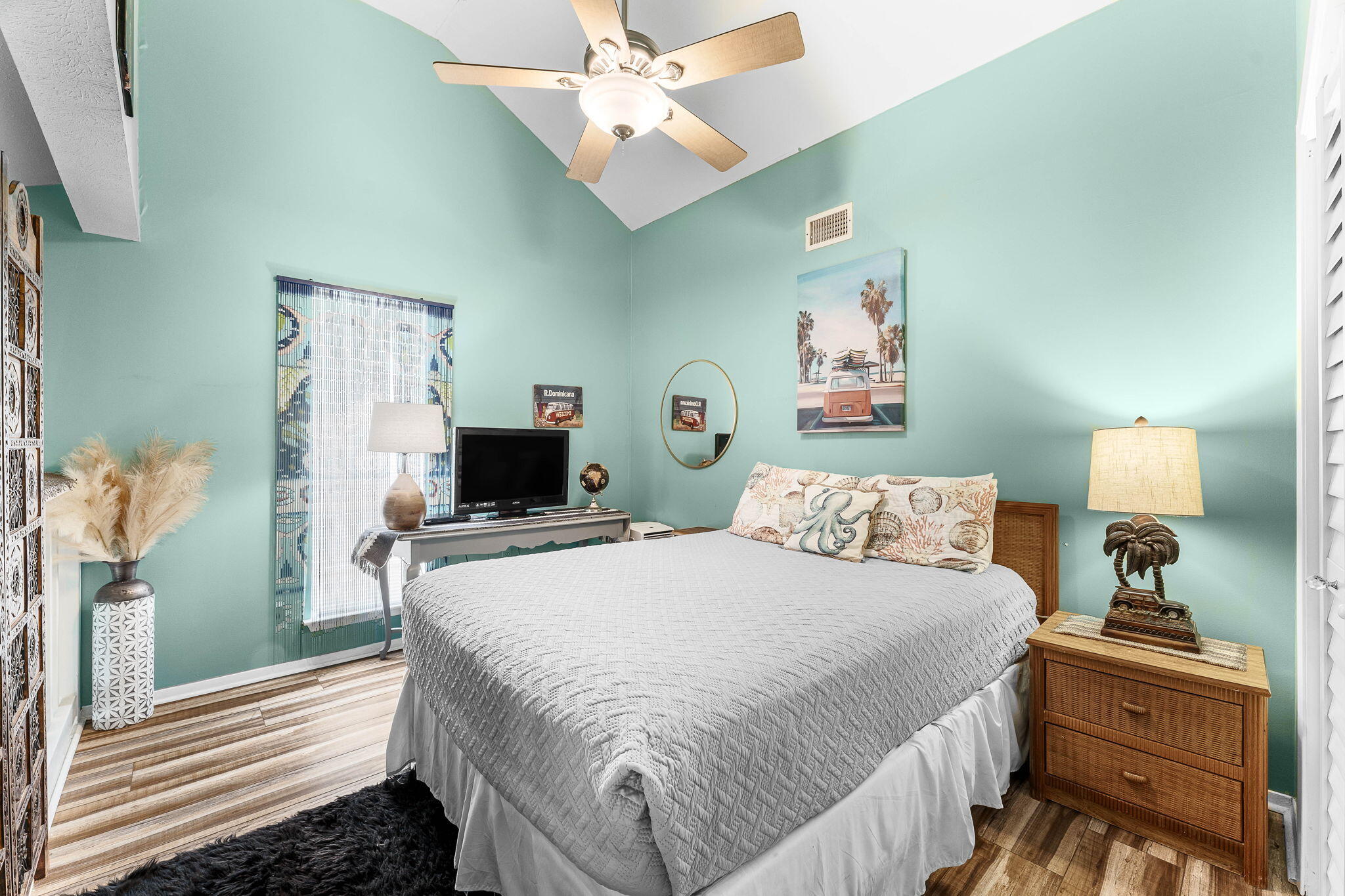 17614 Front Beach Road, Unit D13 Panama City Beach, FL 32413 - Photo 12 of 46 a bedroom with a bed and a chandelier