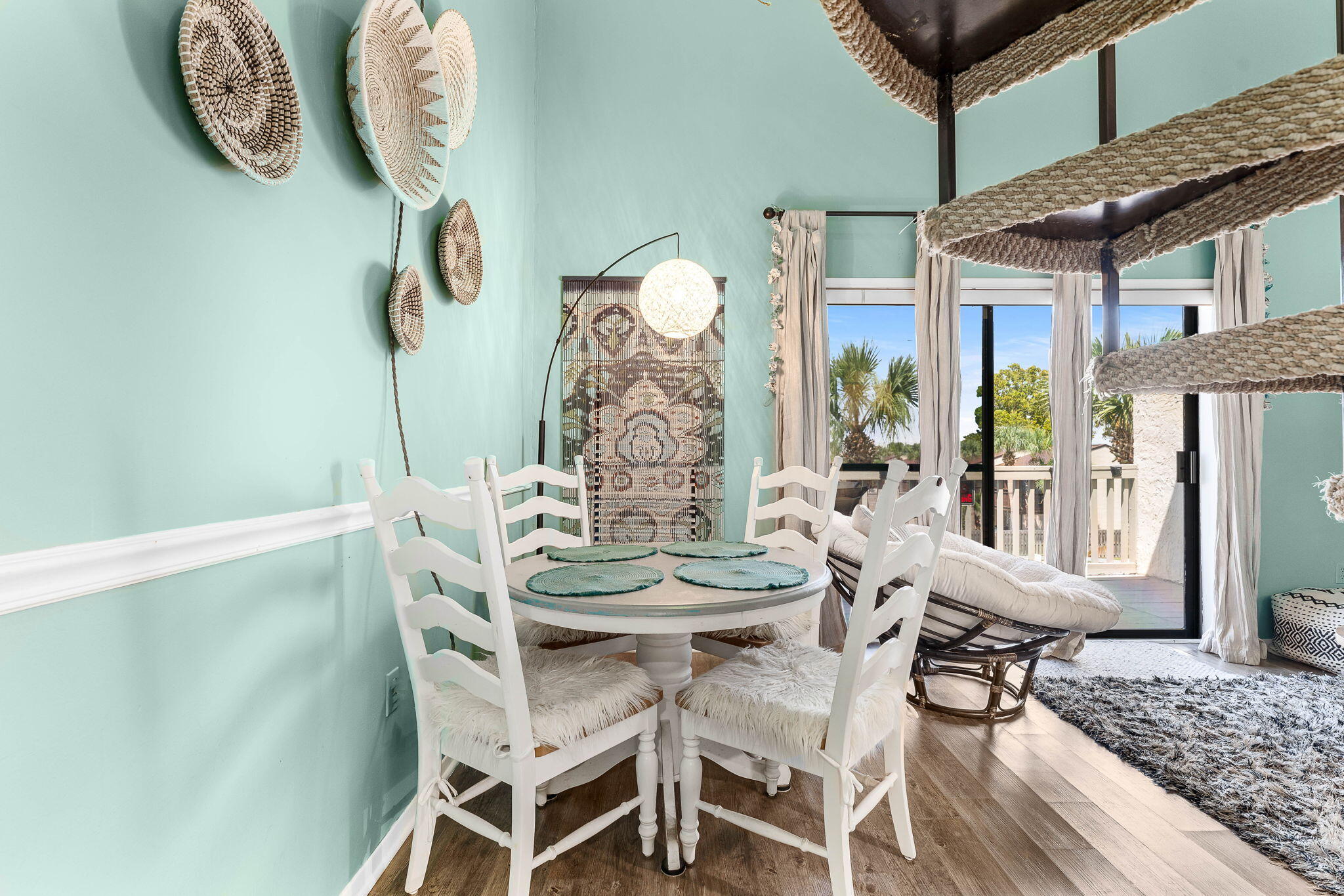 17614 Front Beach Road, Unit D13 Panama City Beach, FL 32413 - Photo 13 of 46 a view of a dining room with furniture and chandelier