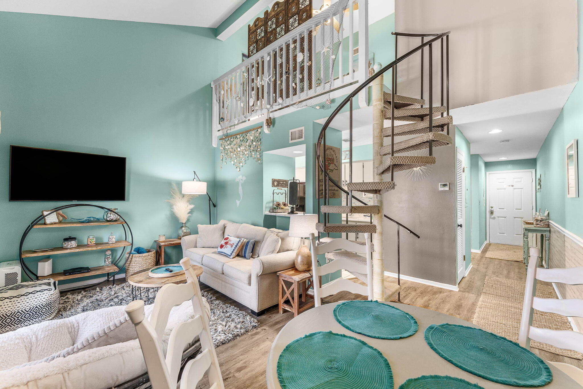 17614 Front Beach Road, Unit D13 Panama City Beach, FL 32413 - Photo 18 of 46 a living room with furniture and a flat screen tv