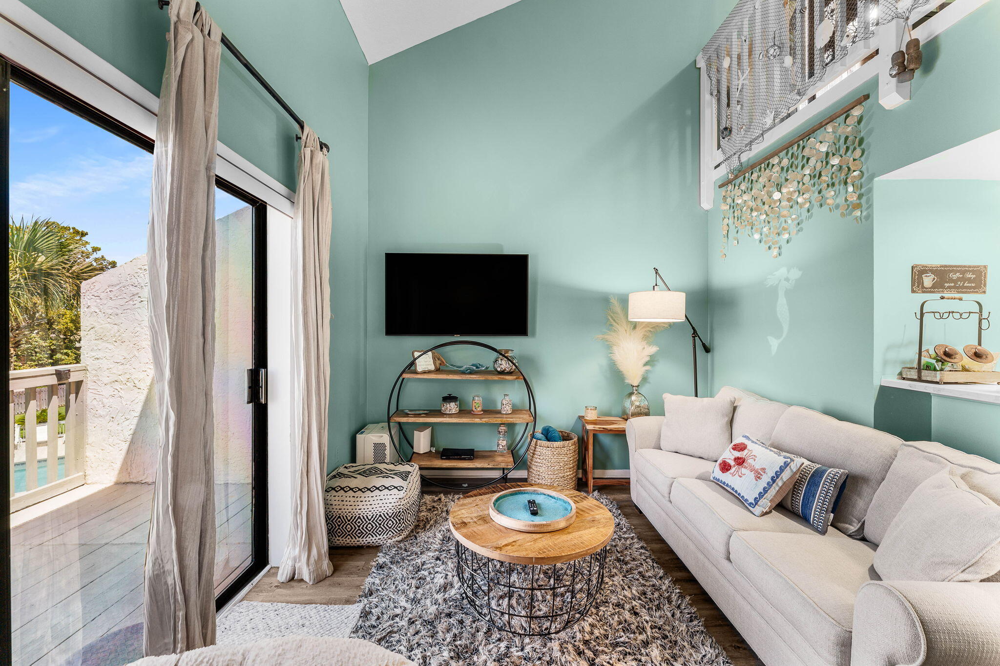 17614 Front Beach Road, Unit D13 Panama City Beach, FL 32413 - Photo 20 of 46 a living room with furniture a rug and a toilet