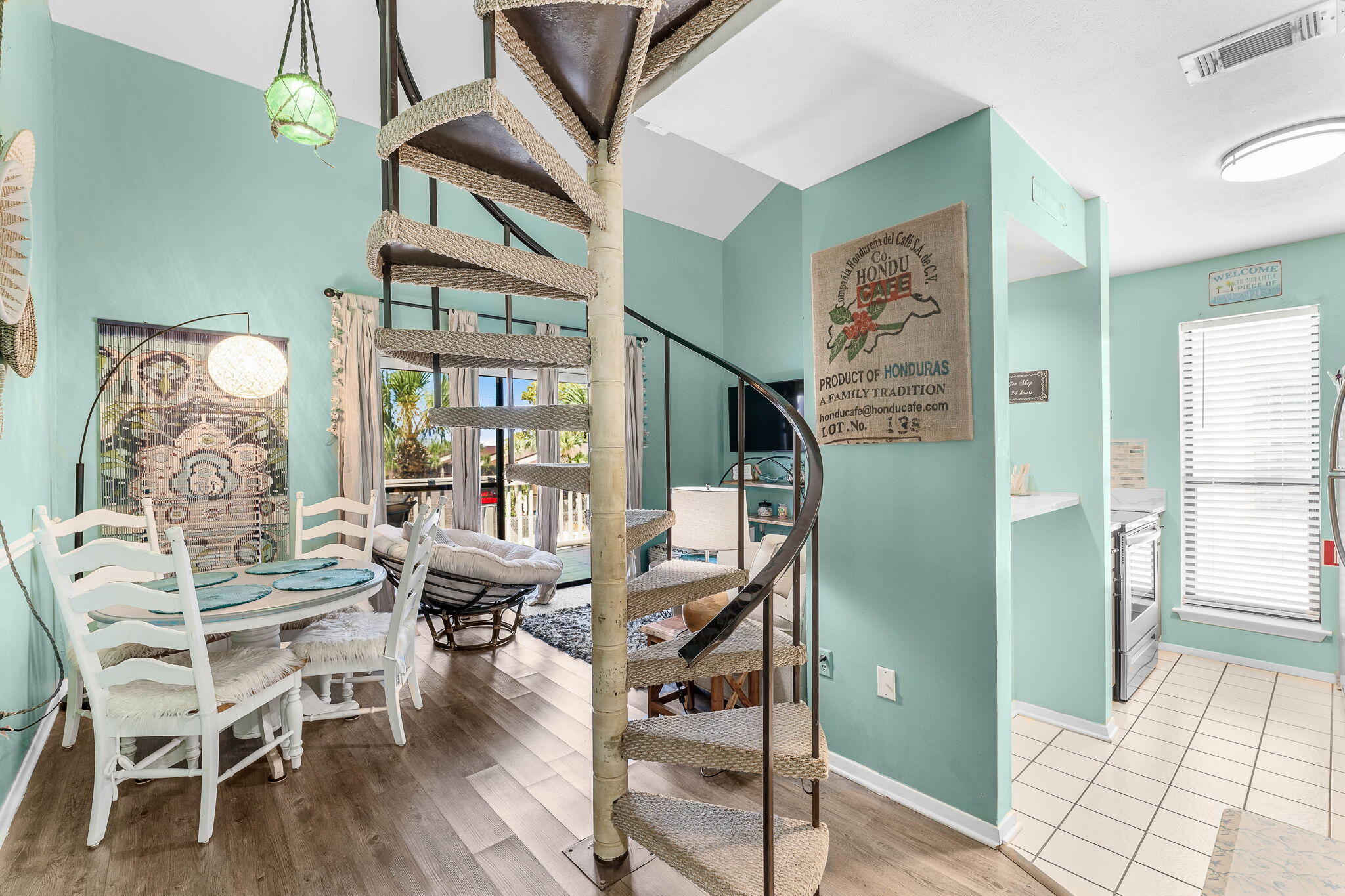 17614 Front Beach Road, Unit D13 Panama City Beach, FL 32413 - Photo 22 of 46 a view of a dining room with furniture window and wooden floor