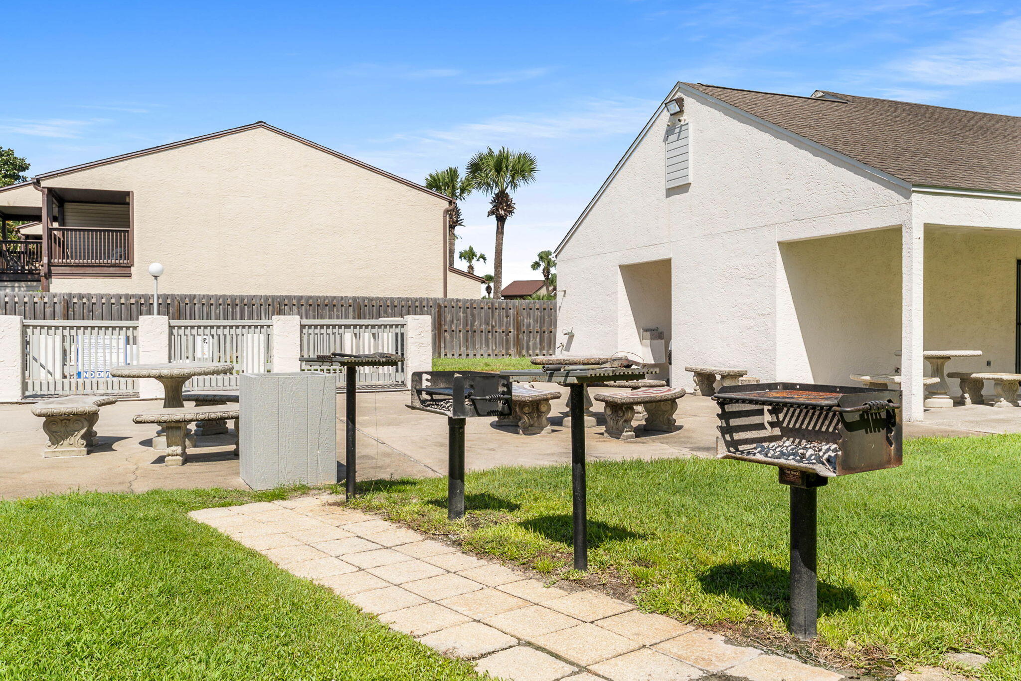 17614 Front Beach Road, Unit D13 Panama City Beach, FL 32413 - Photo 28 of 46 a view of a backyard with chairs
