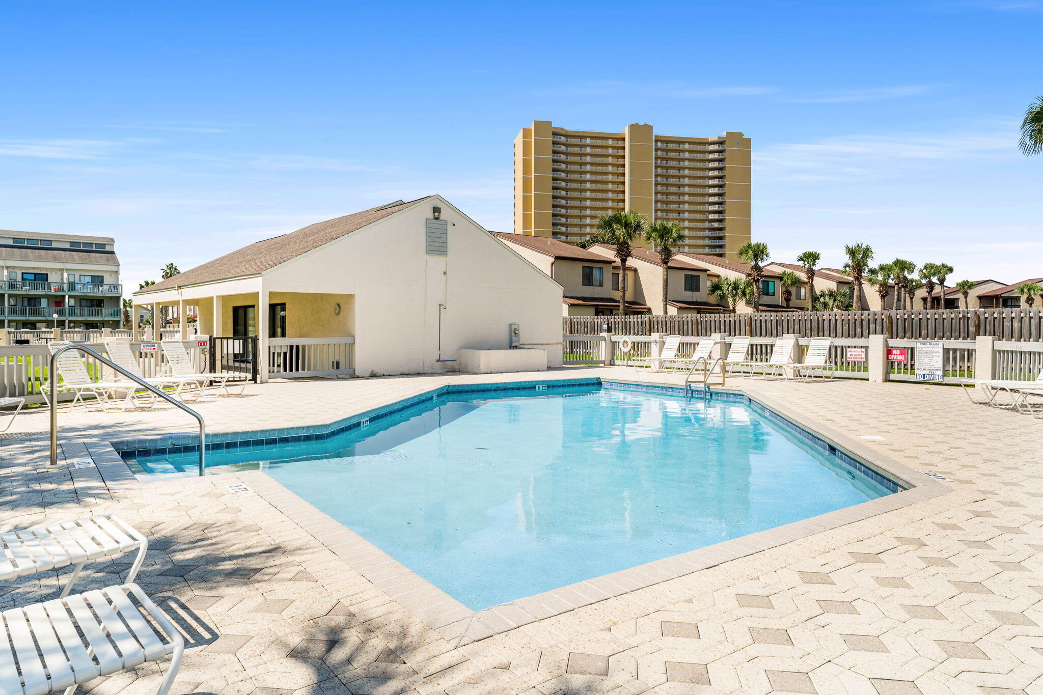 17614 Front Beach Road, Unit D13 Panama City Beach, FL 32413 - Photo 31 of 46 a view of a swimming pool with chairs