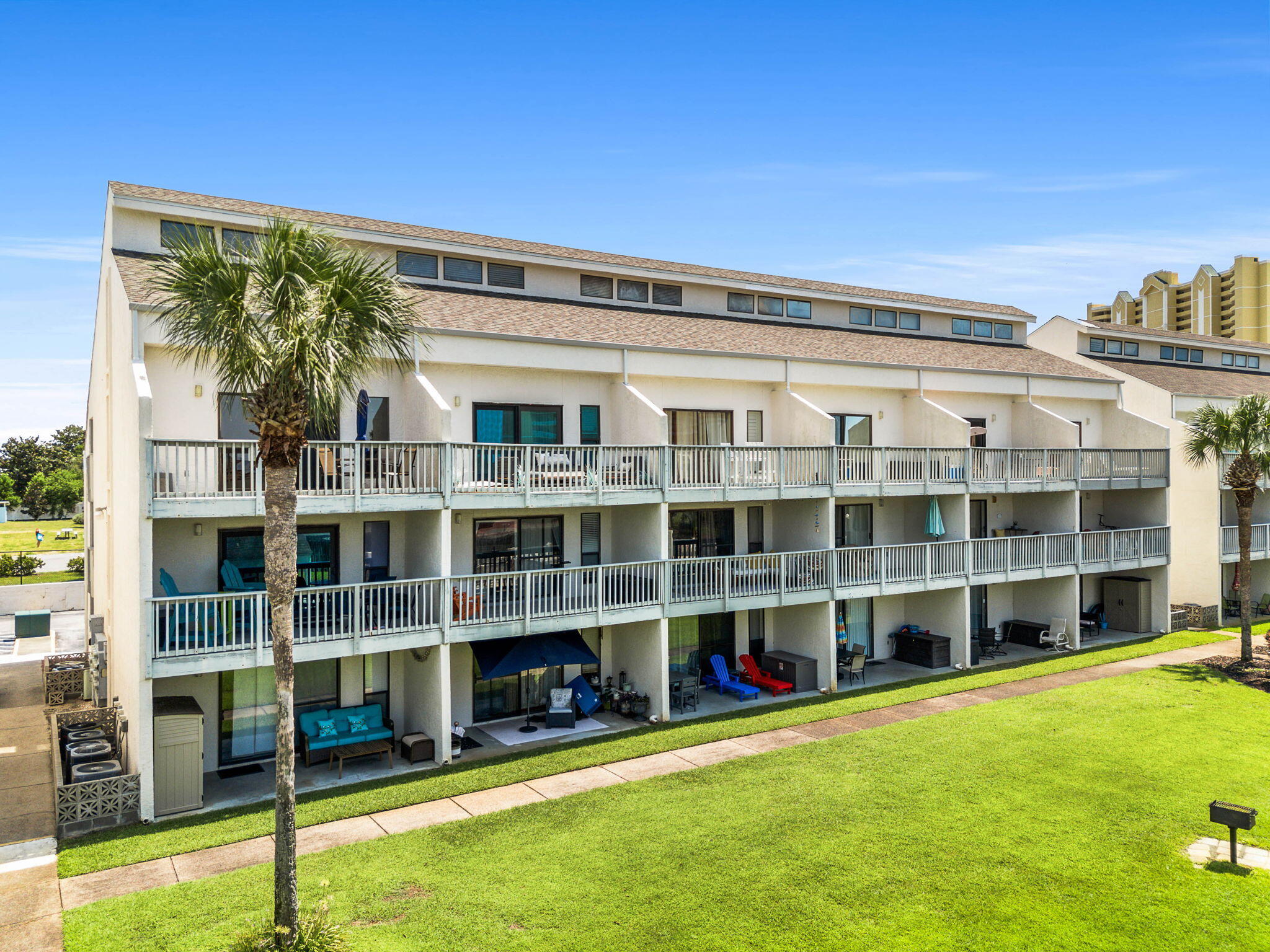 17614 Front Beach Road, Unit D13 Panama City Beach, FL 32413 - Photo 44 of 46 a view of a large building with a large windows