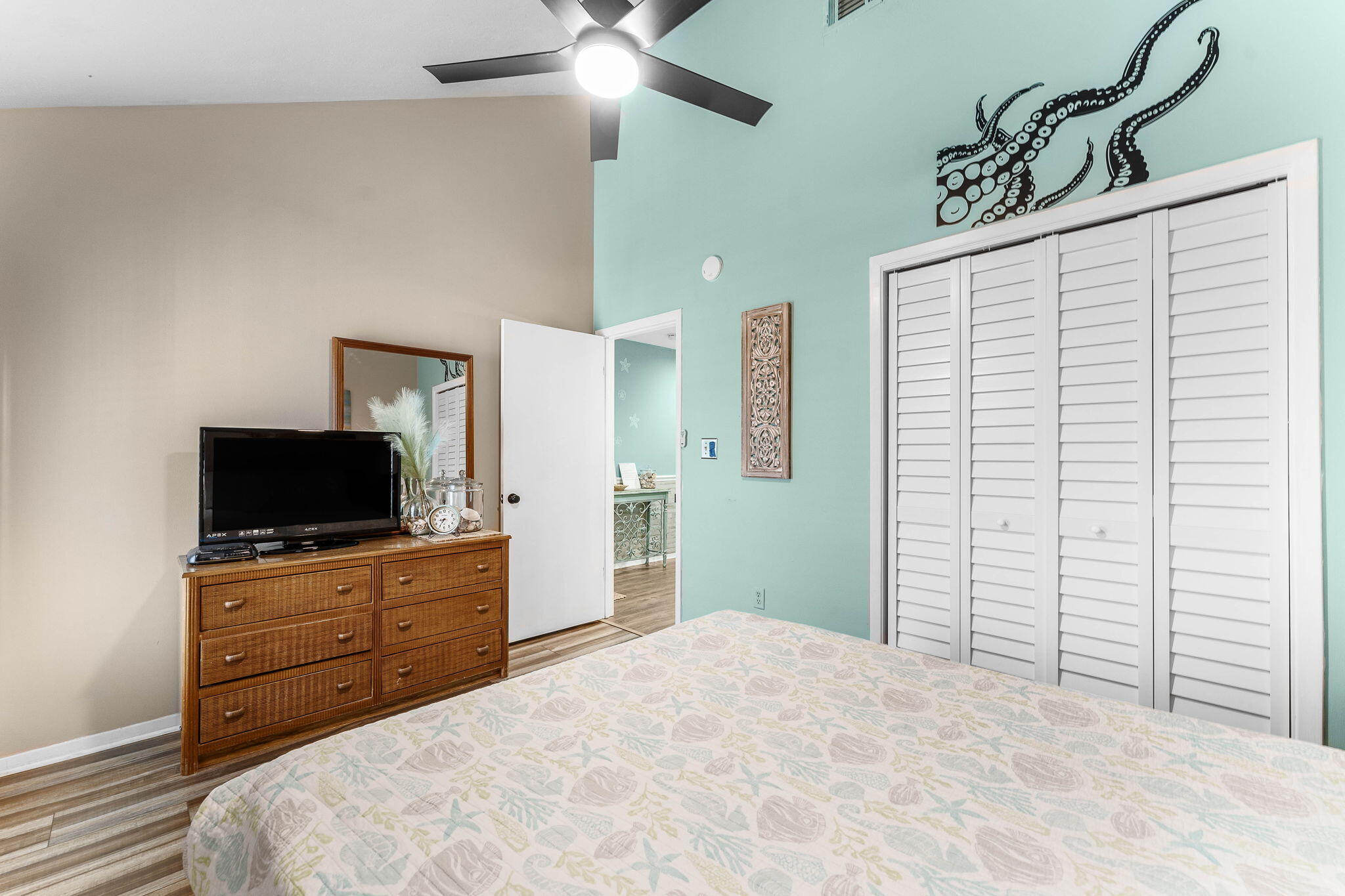 17614 Front Beach Road, Unit D13 Panama City Beach, FL 32413 - Photo 7 of 46 a bedroom with a bed and a flat tv screen on dresser