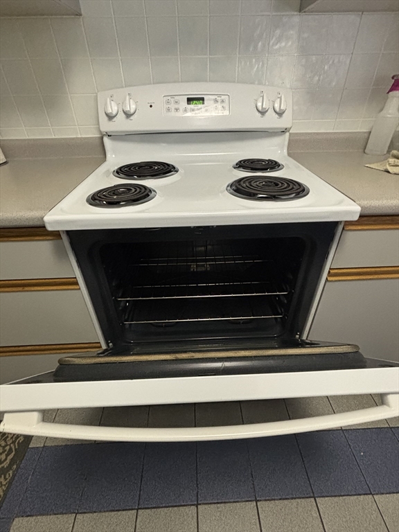 440 North Avenue, Unit 60 Haverhill, MA 01830 - Photo 6 of 9 a stove top oven sitting inside of a kitchen