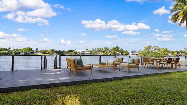 a view of a lake with outdoor seating