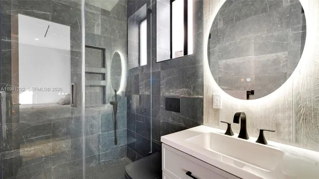 a bathroom with a sink and mirror