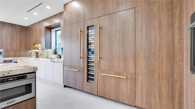 a view of a kitchen from the hallway