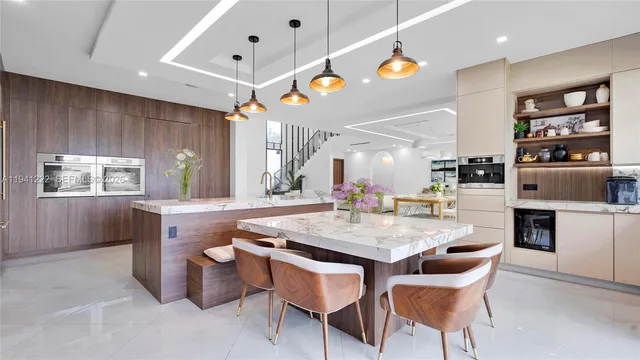 a dining table with chairs and window