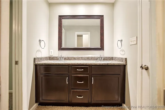 a view of a yard with a house and large tree