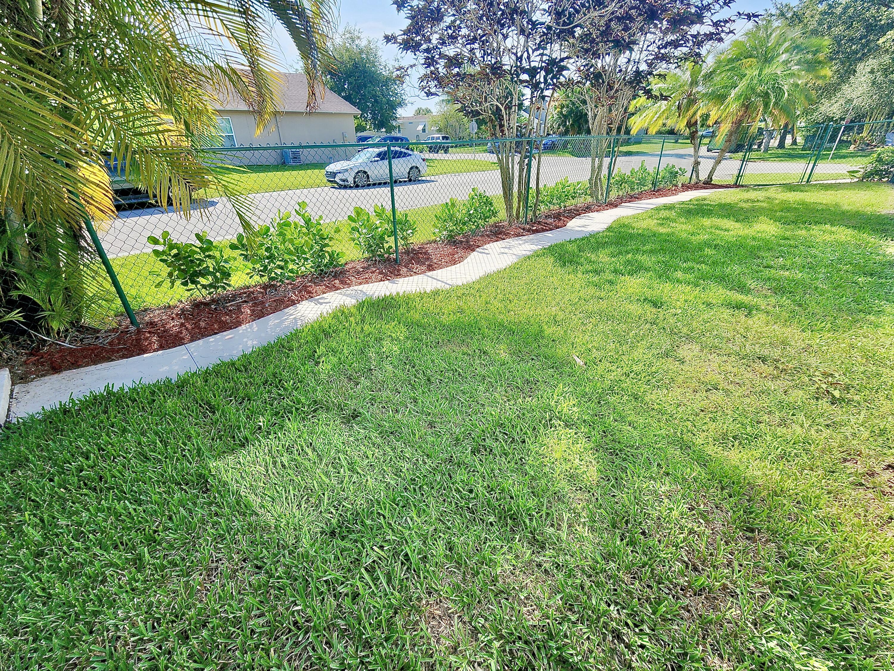 2464 Southwest Omega Way Stuart, FL 34997 - Photo 27 of 70 West Yard fully fenced