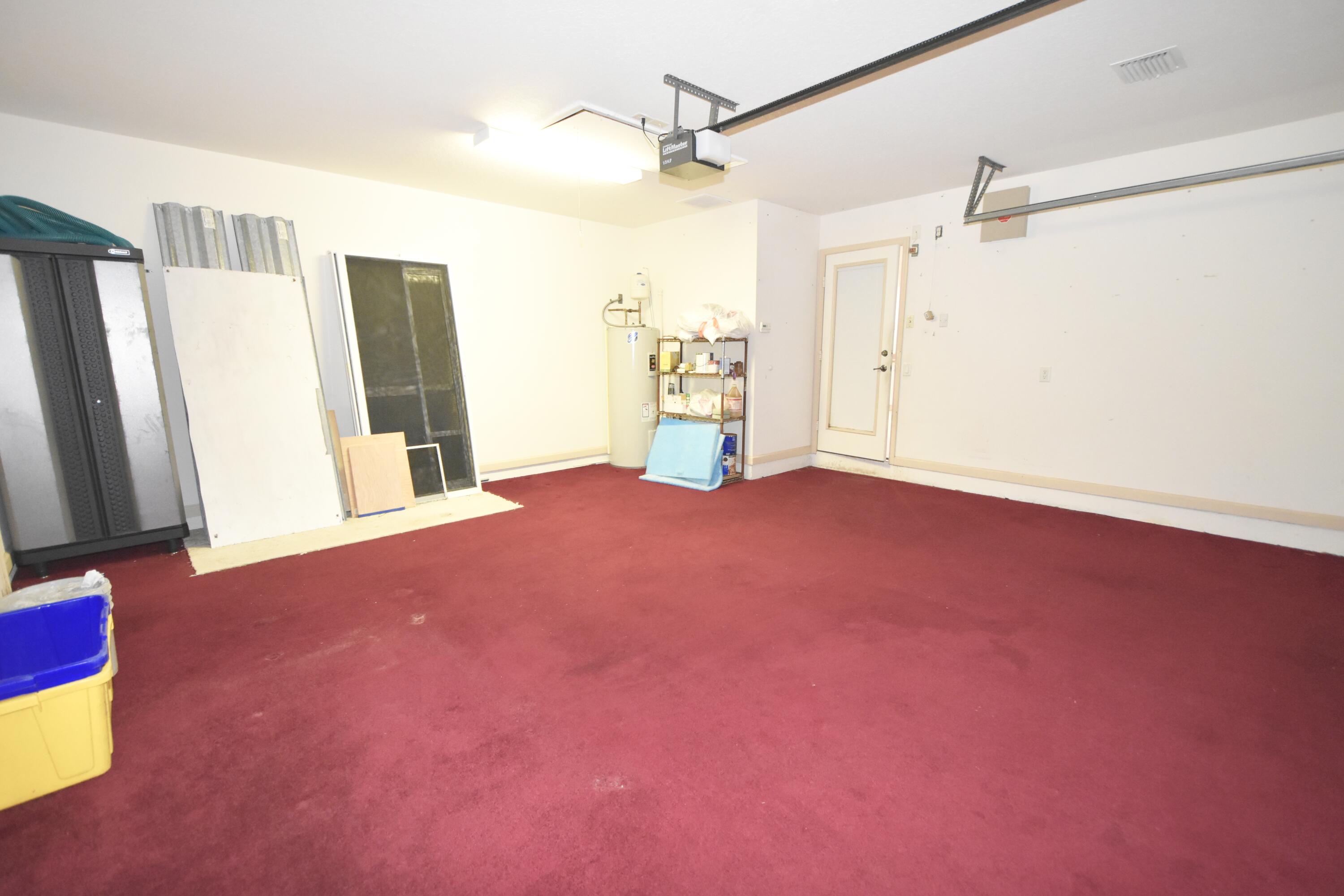 2464 Southwest Omega Way Stuart, FL 34997 - Photo 37 of 70 Garage air conditioned& Insulated