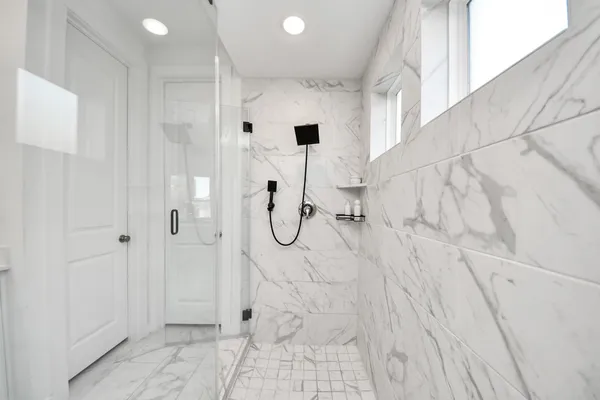 a bathroom with a bathtub and a shower