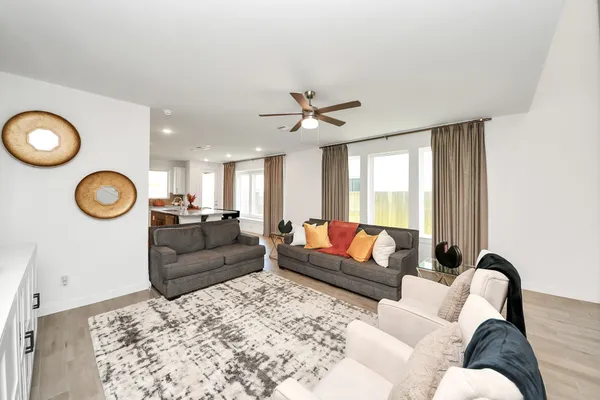 a living room with furniture and a window