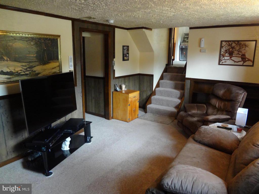 116 Winter Hill Road Lititz, PA 17543 - Photo 15 of 30 a living room with furniture and a flat screen tv