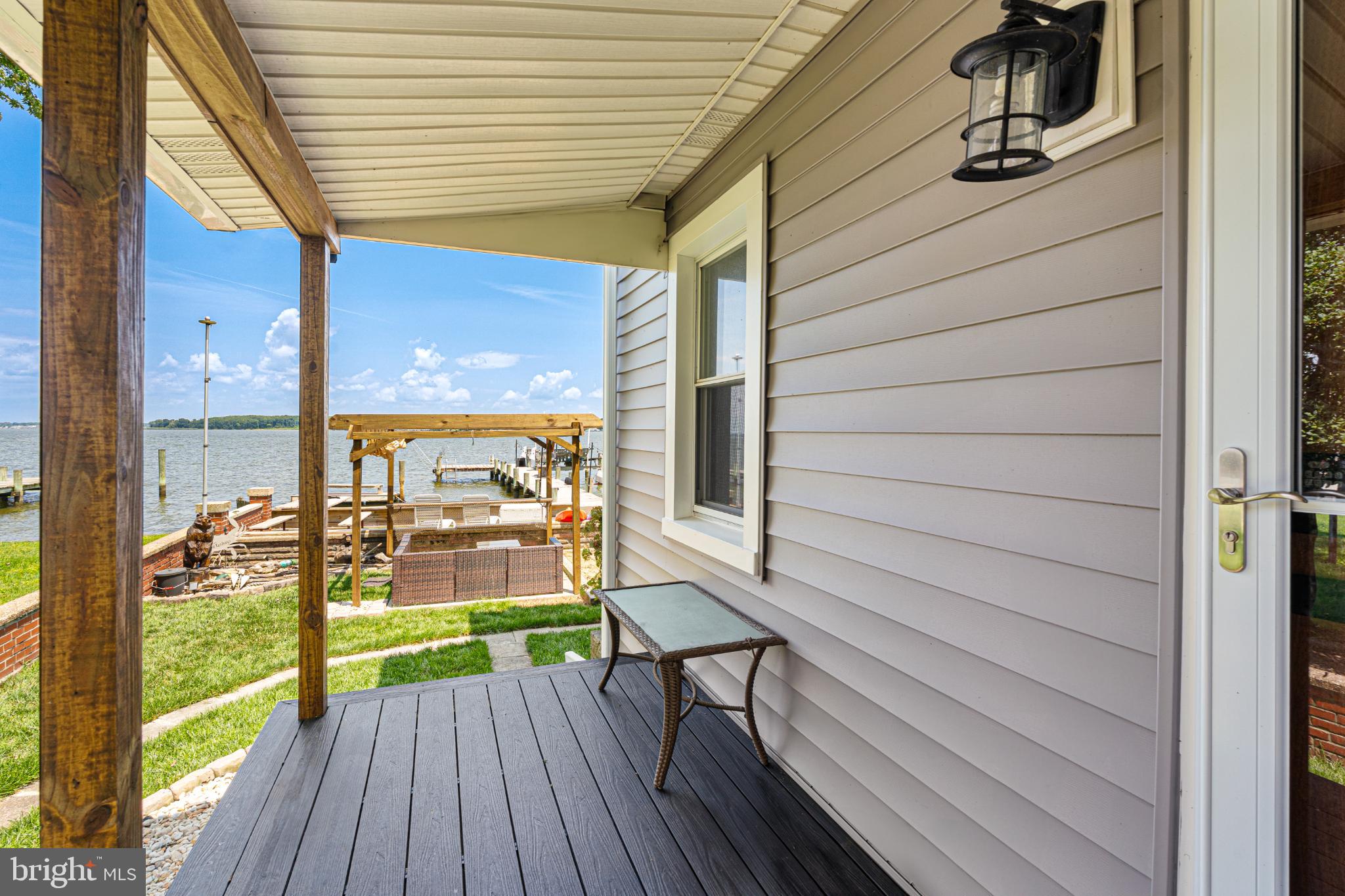 7118 River Drive Road Sparrows Point, MD 21219 - Photo 25 of 52 Serene waterfront retreat with inviting porch.