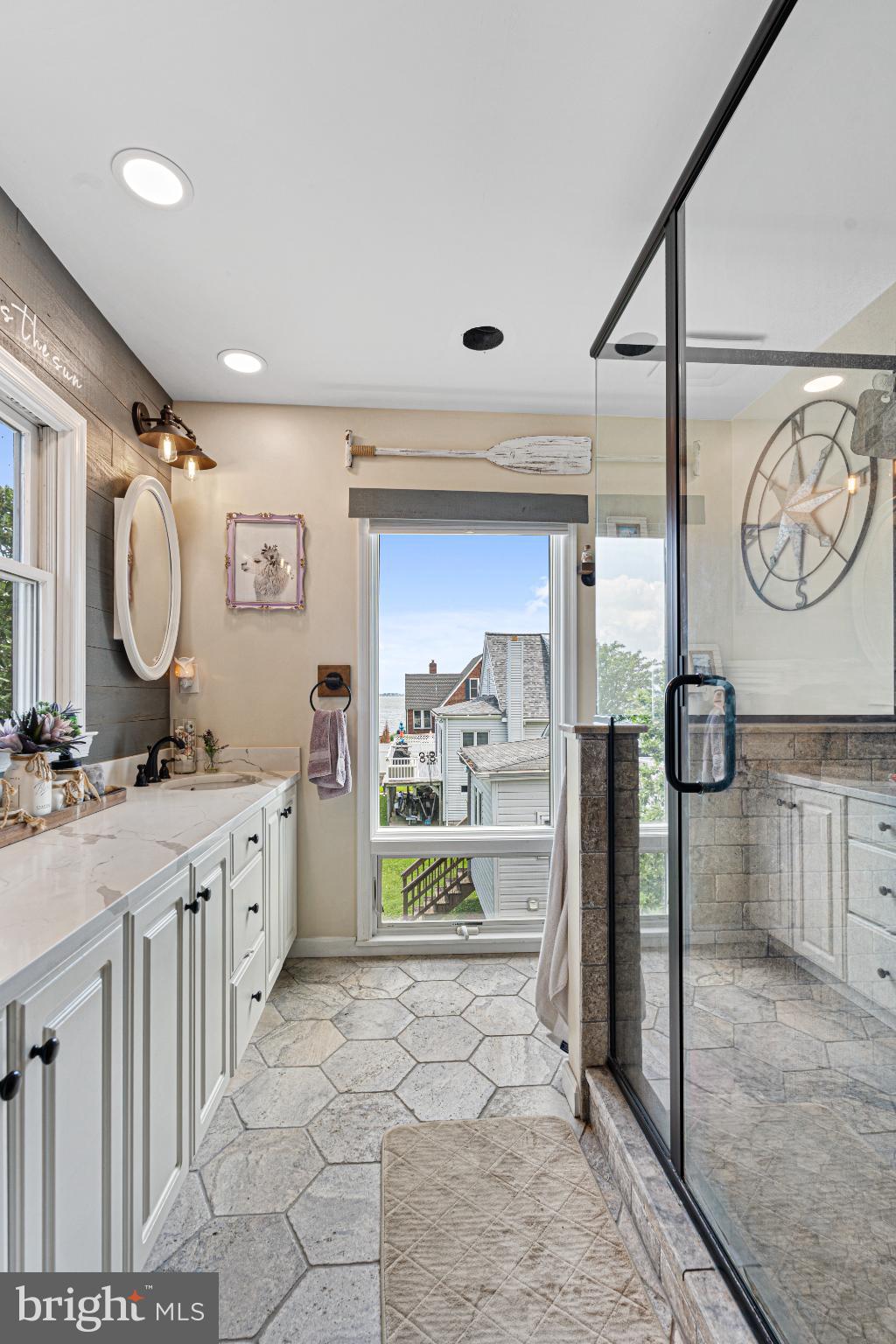 7118 River Drive Road Sparrows Point, MD 21219 - Photo 32 of 52 Bright and airy coastal-inspired bathroom retreat.
