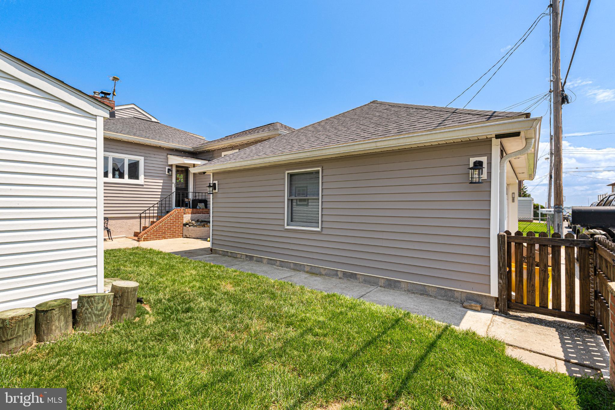 7118 River Drive Road Sparrows Point, MD 21219 - Photo 6 of 52 Charming side view of a cozy residence.