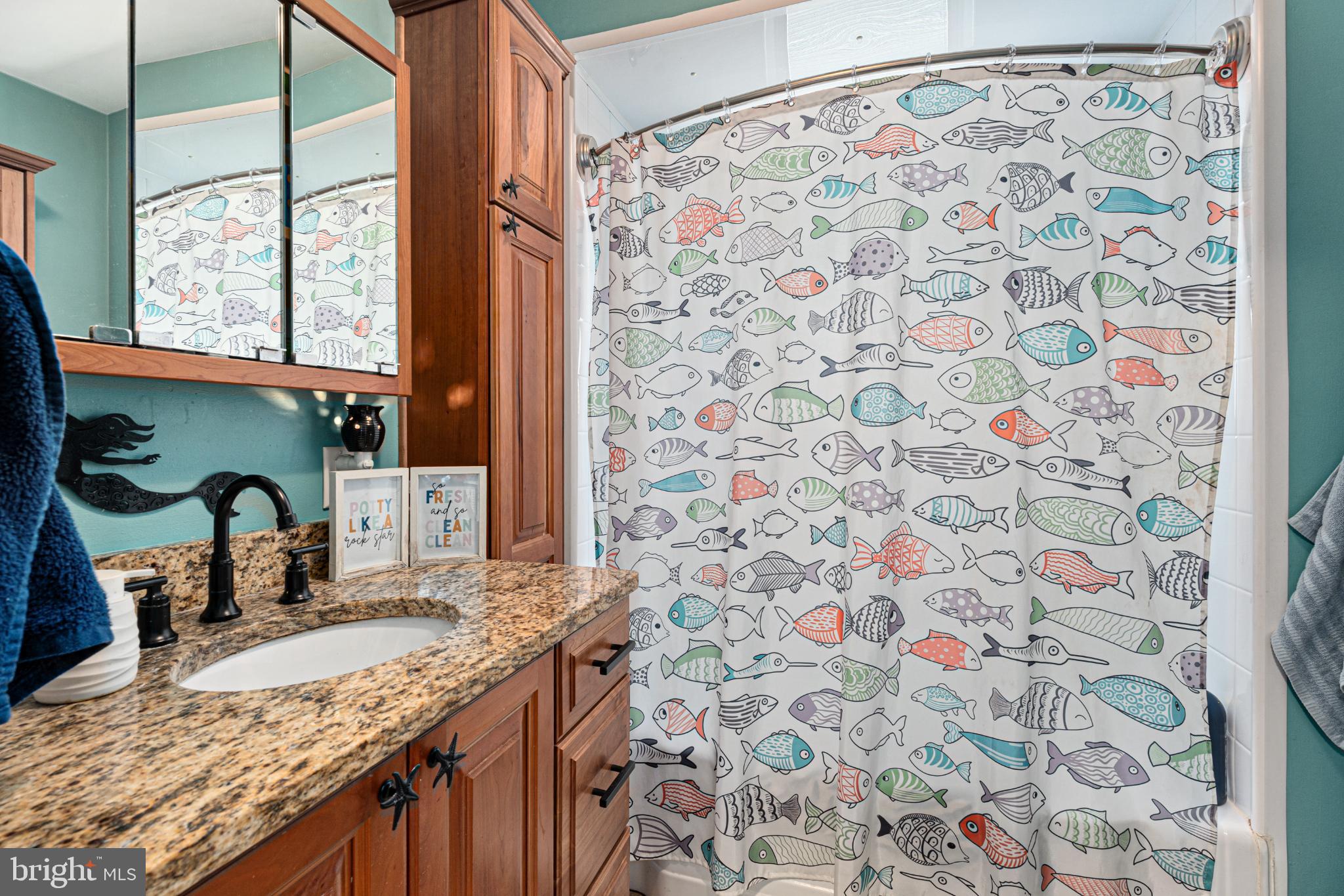 7118 River Drive Road Sparrows Point, MD 21219 - Photo 7 of 52 Charming bathroom with playful fish decor.