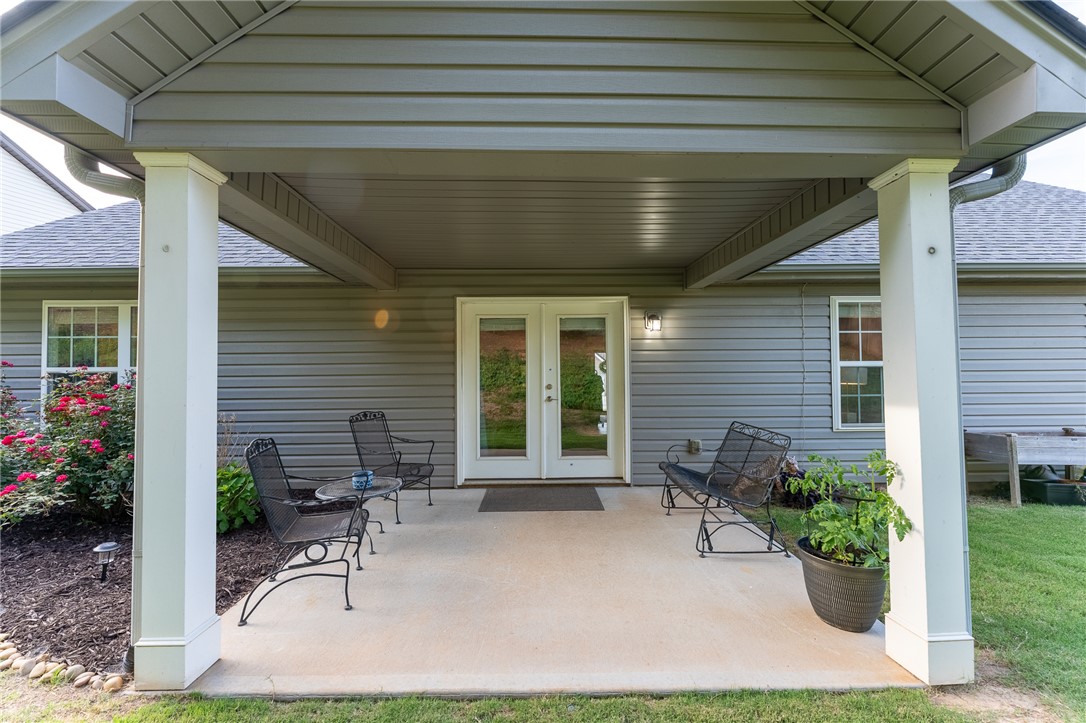 1012 Whirlaway Circle Anderson, SC 29621 - Photo 22 of 25 A welcoming covered patio extends from the home's rear, offering a tranquil outdoor retreat.