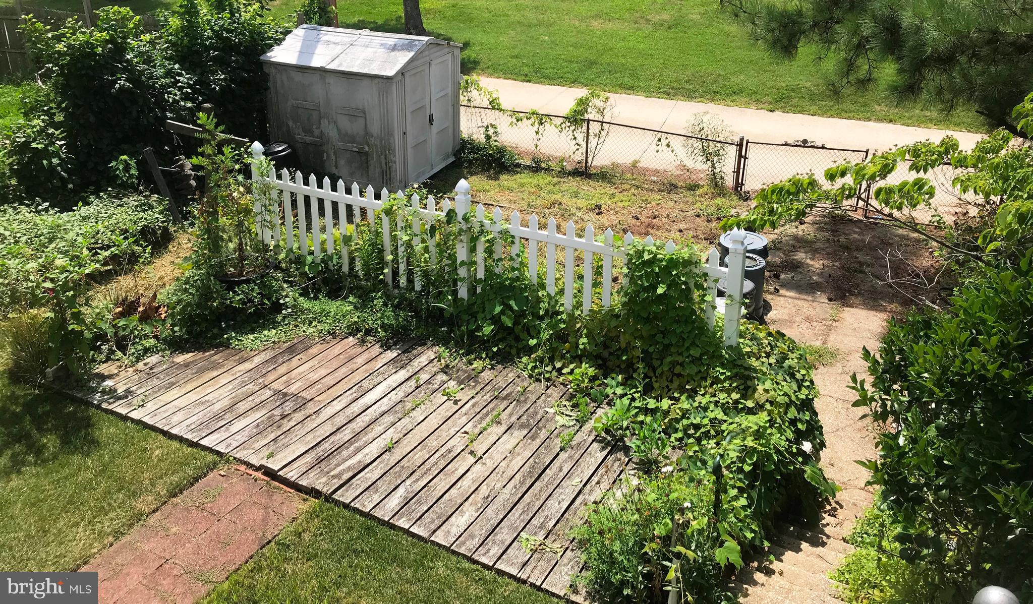 1 car parking pad and shed - small deck/patio area