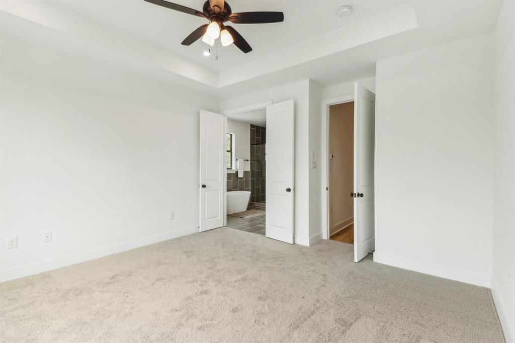 313 Tennessee Street Houston, TX 77029 - Photo 7 of 15 a view of a big room with chandelier fan and closet