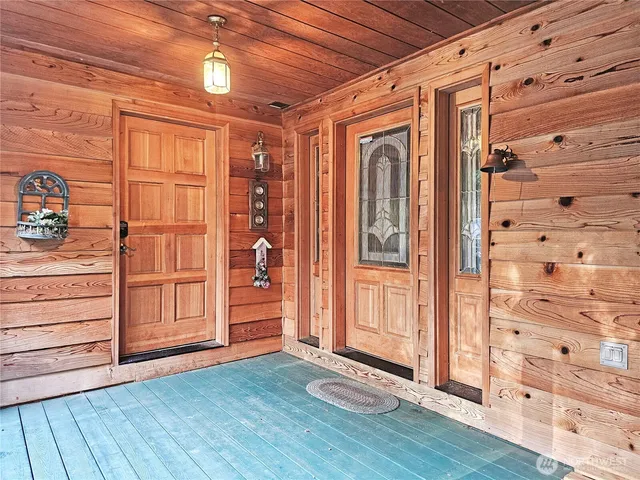 a view of walk in closet with wooden floor