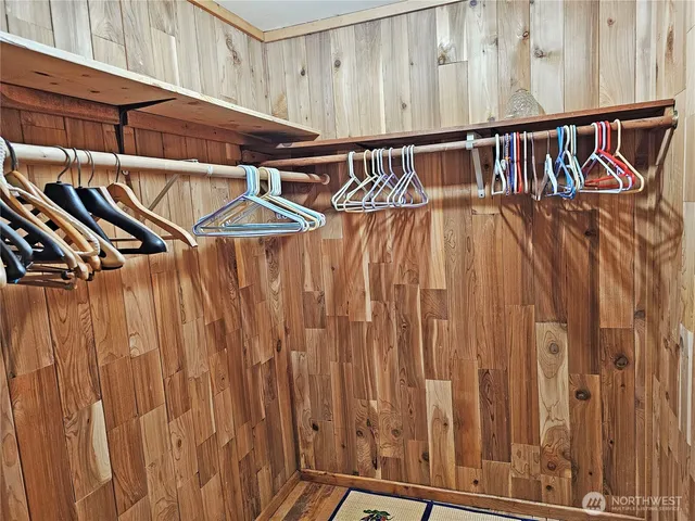 a spacious bedroom with a bed and a window