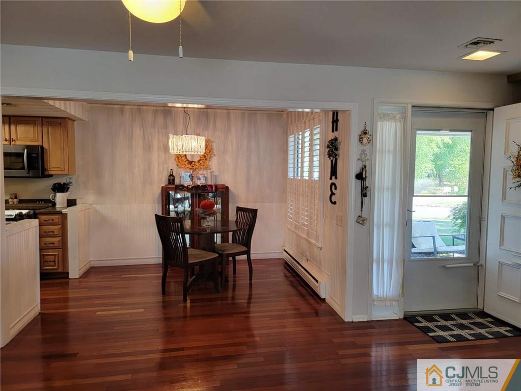 35 Haddon Road, Unit A Monroe Township, NJ 08831 - Photo 7 of 18 a dining room with furniture and wooden floor