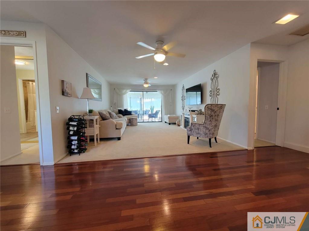 35 Haddon Road, Unit A Monroe Township, NJ 08831 - Photo 8 of 18 a view of a room with kitchen island stainless steel appliances wooden floor and window