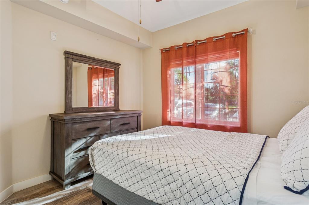 1231 Godavari Way, Unit 101 Wesley Chapel, FL 33543 - Photo 13 of 36 a bedroom with a bed and window