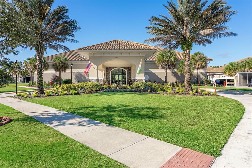 1231 Godavari Way, Unit 101 Wesley Chapel, FL 33543 - Photo 27 of 36 a front view of a house with a yard