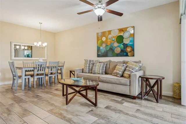 a living room with furniture and a rug