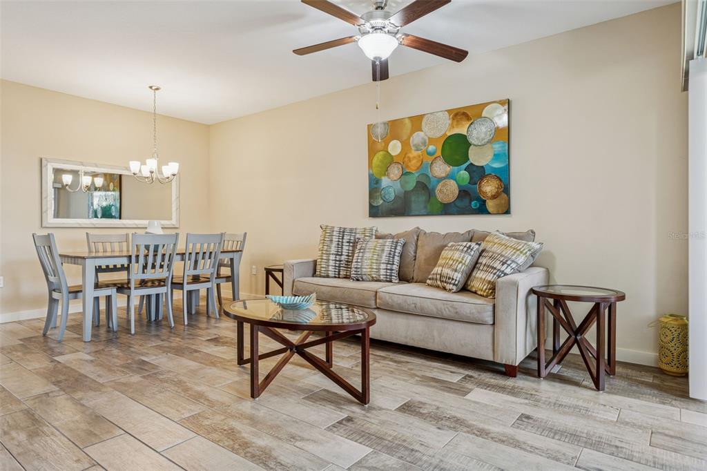 1231 Godavari Way, Unit 101 Wesley Chapel, FL 33543 - Photo 10 of 36 a living room with furniture and a rug