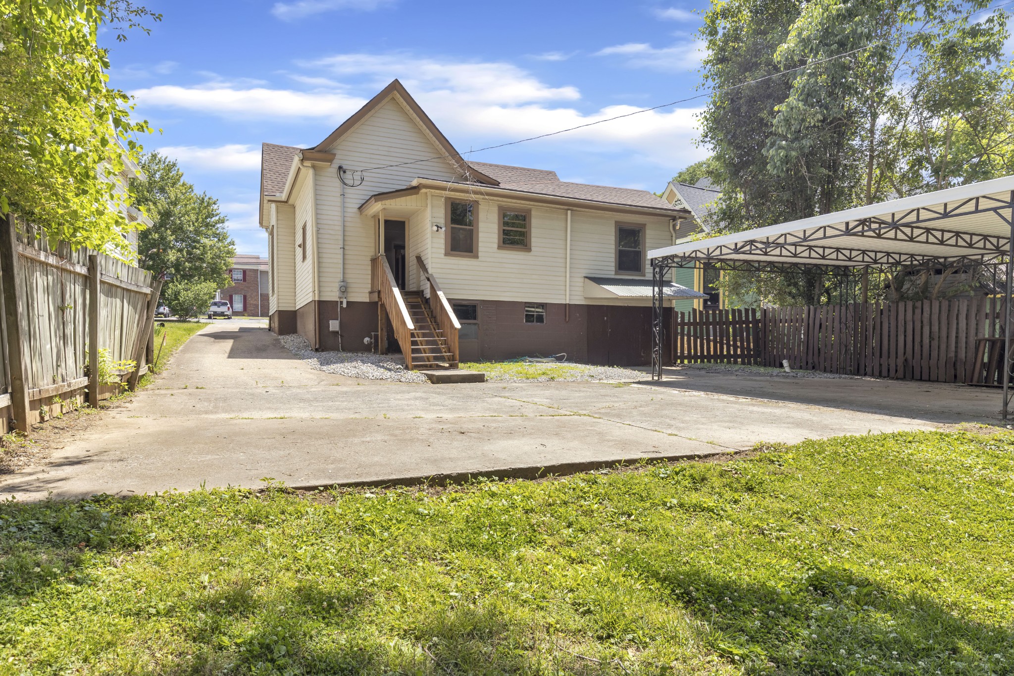 115 North Main Street Springfield, TN 37172 - Photo 5 of 24 a view of a house with backyard and trees