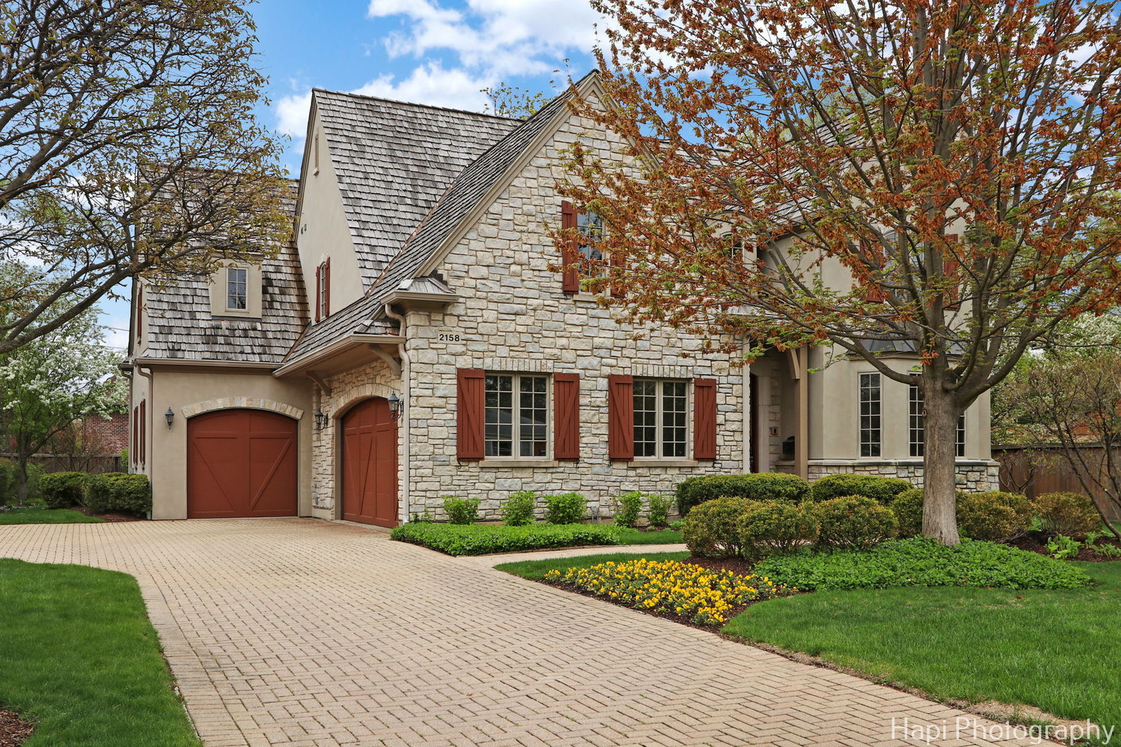 a front view of a house with garden