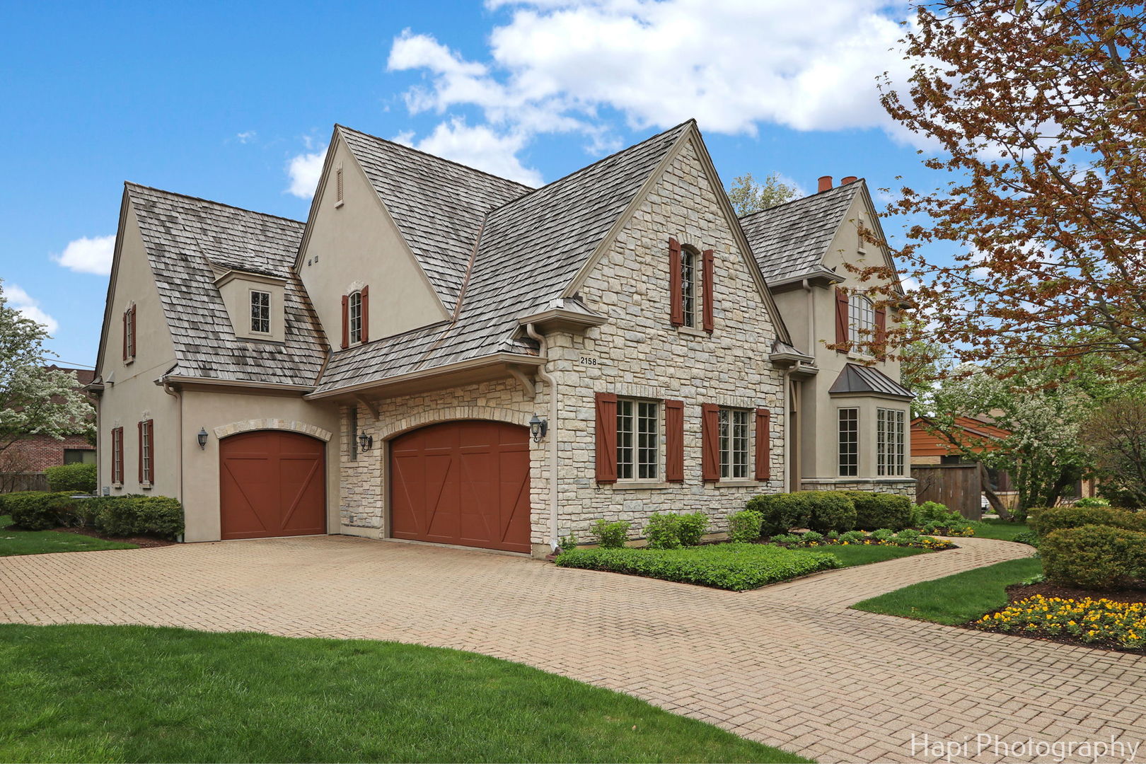 2158 Scott Road Northbrook, IL 60062 - Photo 2 of 57 a front view of a house with a yard and garage