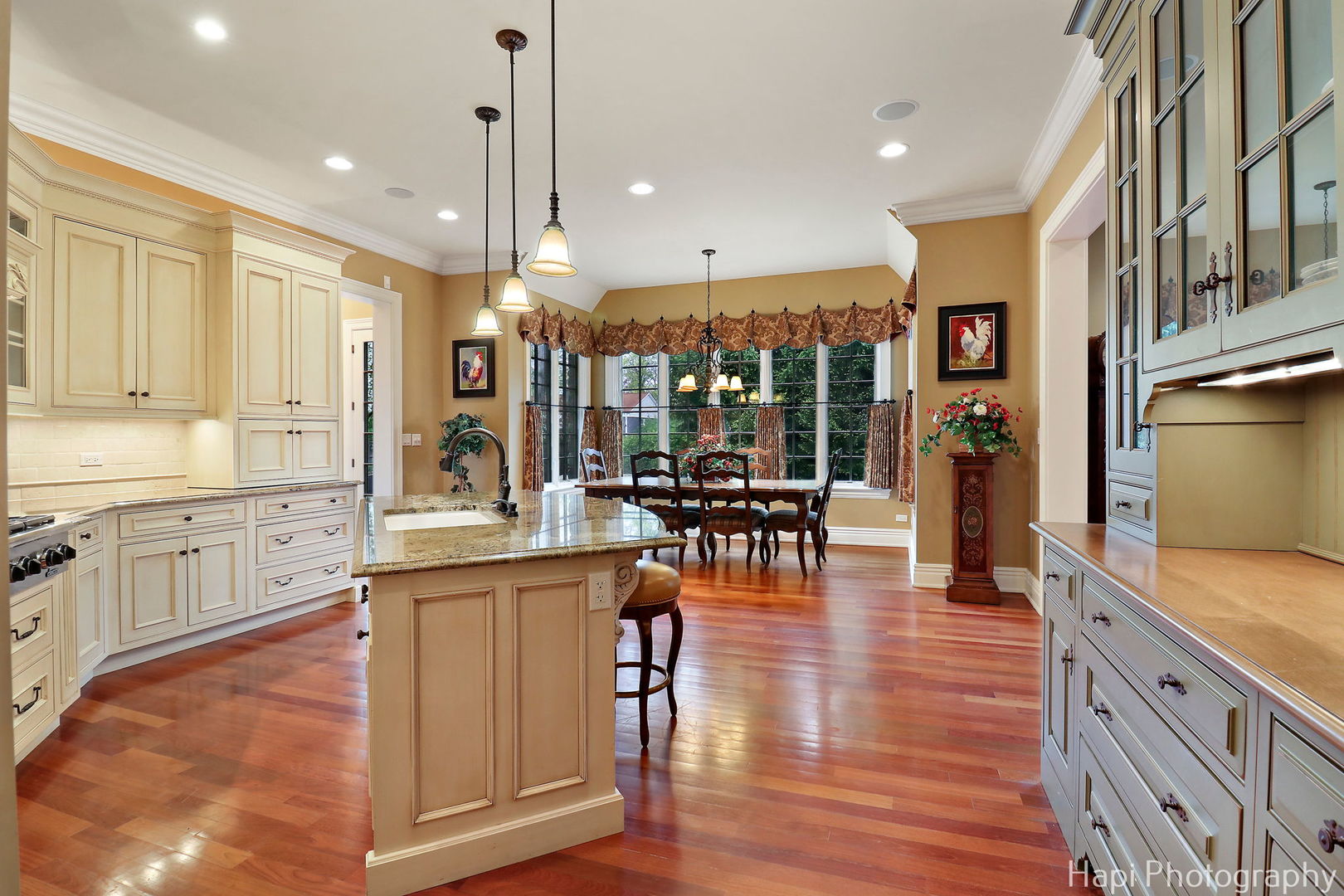 2158 Scott Road Northbrook, IL 60062 - Photo 21 of 57 a kitchen with stainless steel appliances granite countertop sink stove refrigerator dining table and chairs