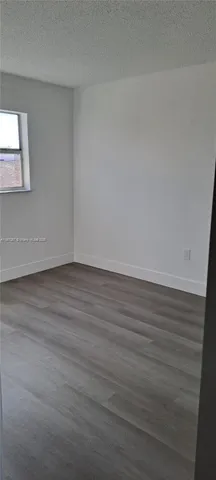 a view of a hallway with windows