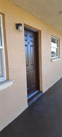 a view of a car garage both side of a road