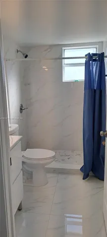 a bathroom with a sink a toilet and vanity