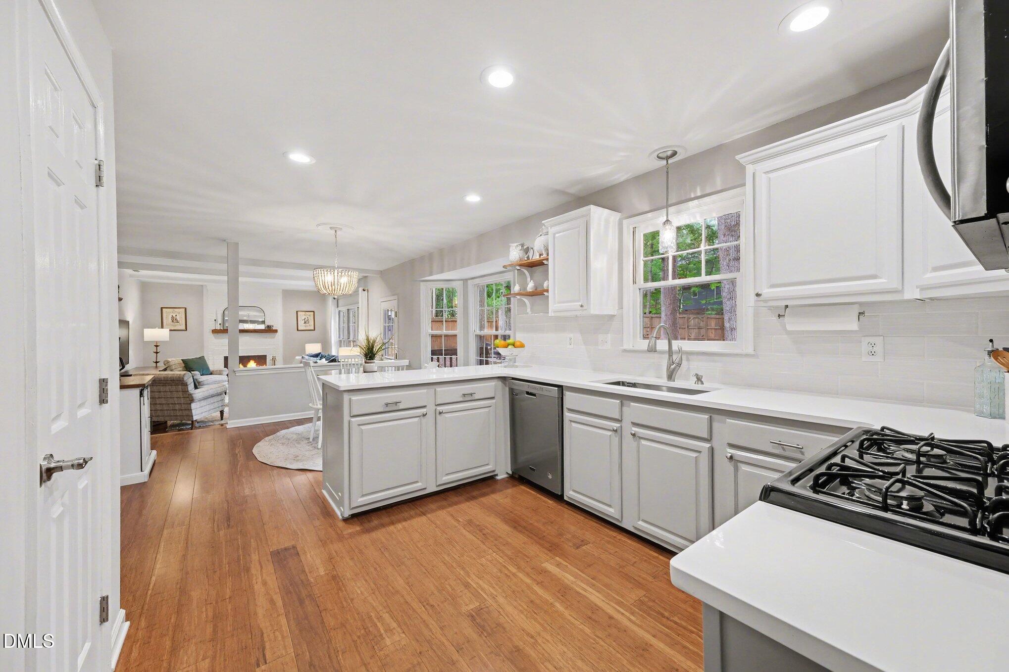 103 Leckford Way Cary, NC 27513 - Photo 15 of 49 a kitchen with a sink appliances and cabinets