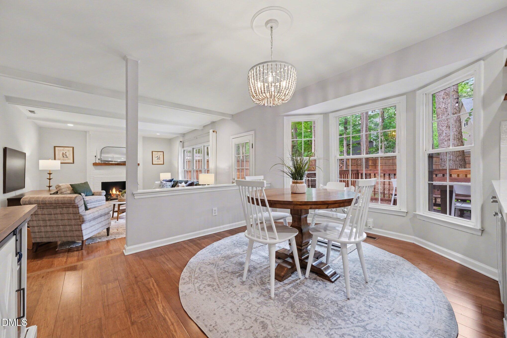 103 Leckford Way Cary, NC 27513 - Photo 16 of 49 a view of a dining room with furniture window and wooden floor