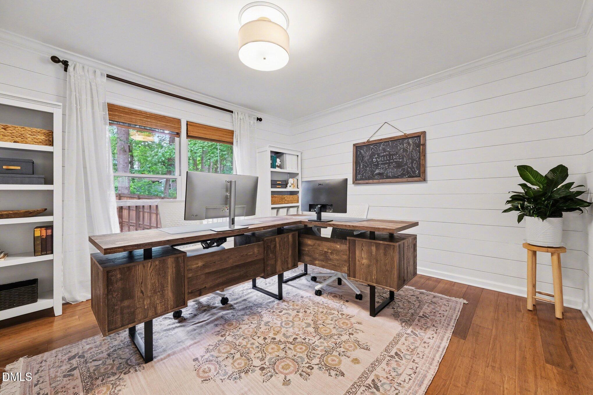 103 Leckford Way Cary, NC 27513 - Photo 19 of 49 a view of a workspace with furniture and a window